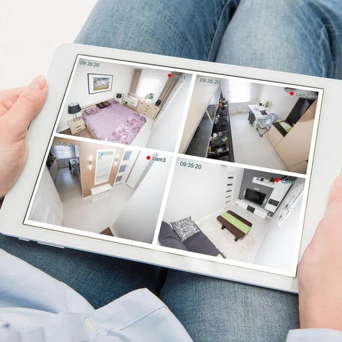 Women viewing her security cameras on an iPad